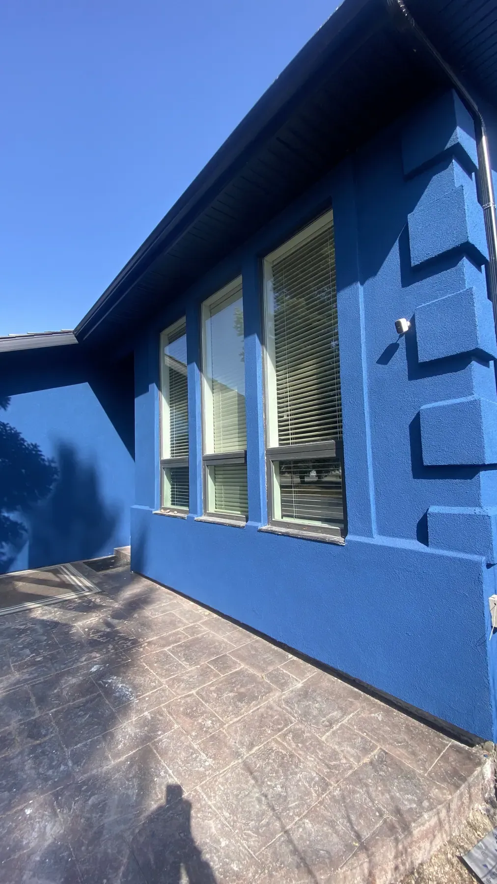 Home finished in blue acrylic stucco