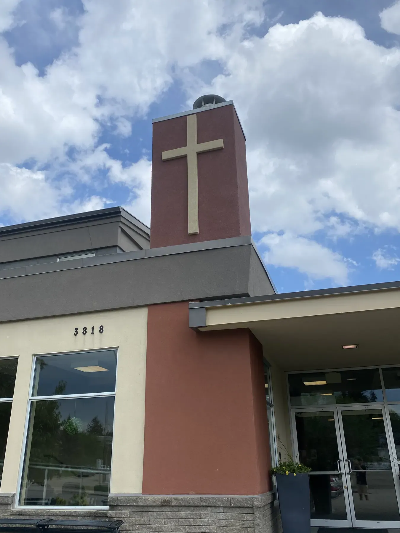 Church entrance and bell tower after an exterior stucco renovation