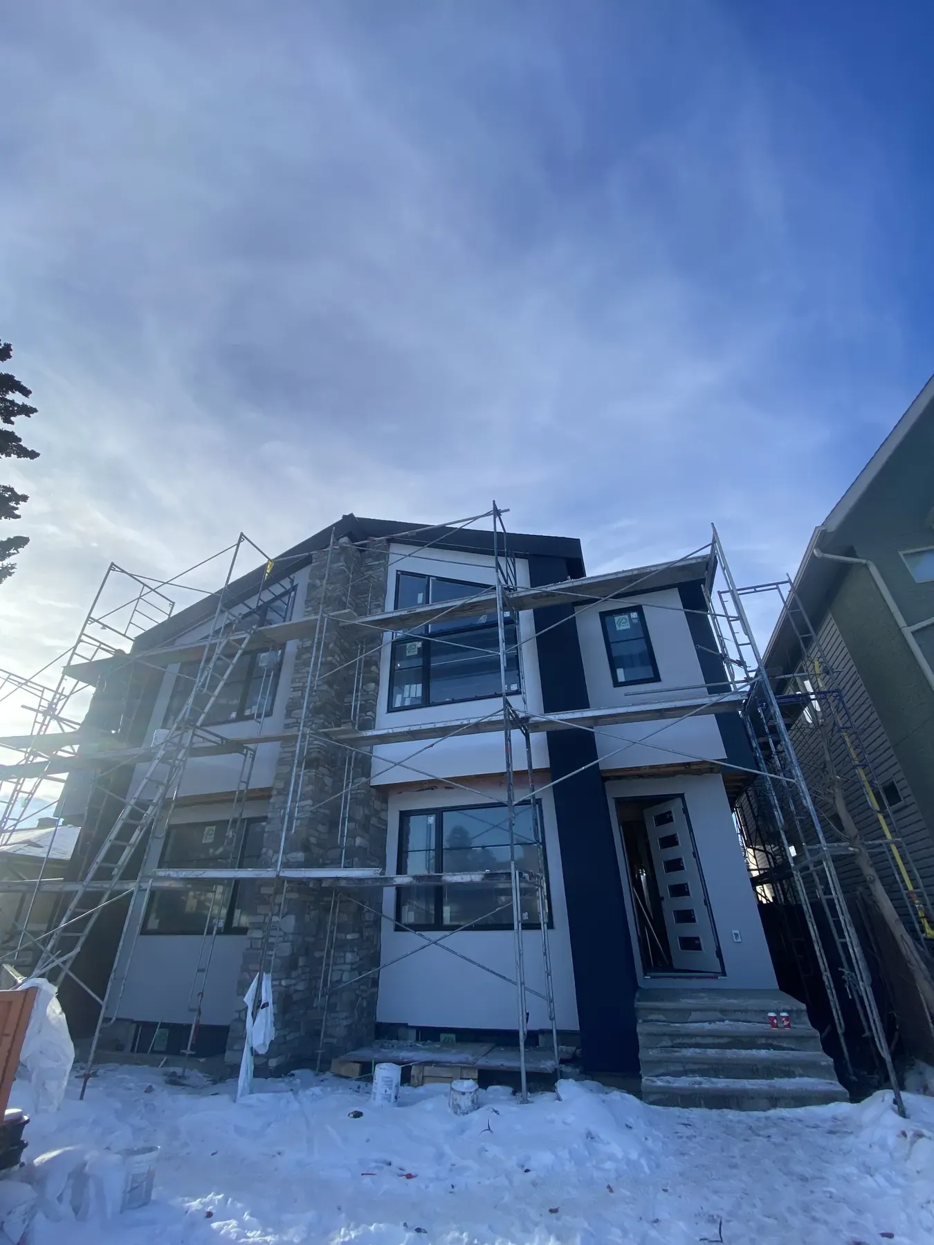 Infill home exterior work in winter