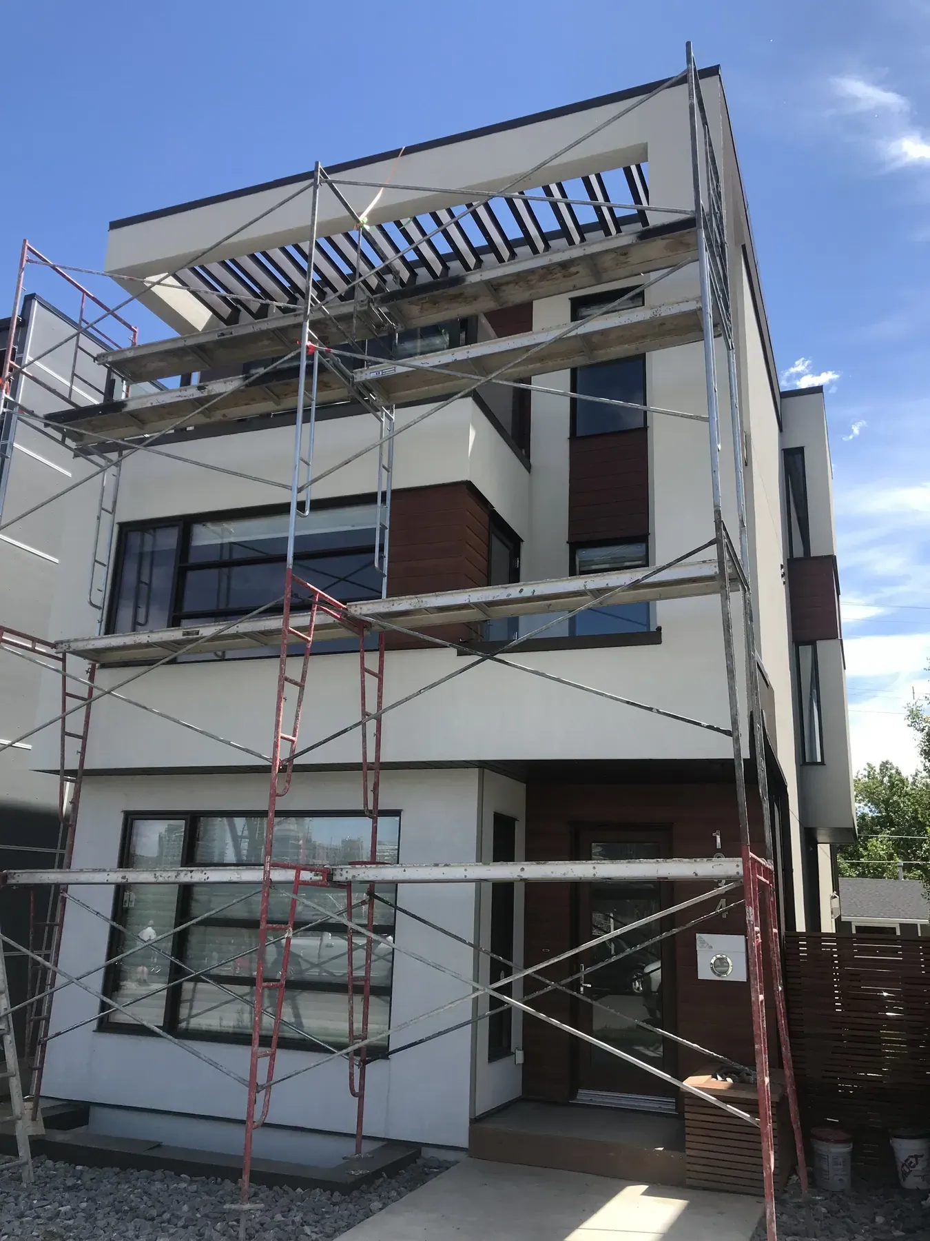 Infill exterior under scaffolding before the finish coat