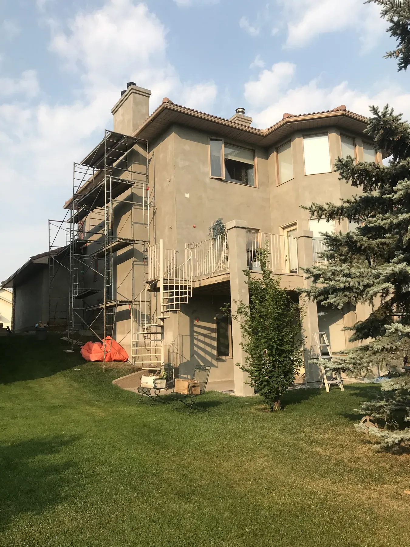 Two-storey home during re-stucco